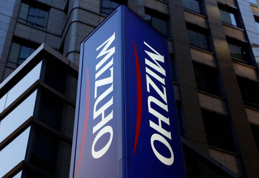 FILE PHOTO: Mizuho Bank's signboard is pictured in Tokyo